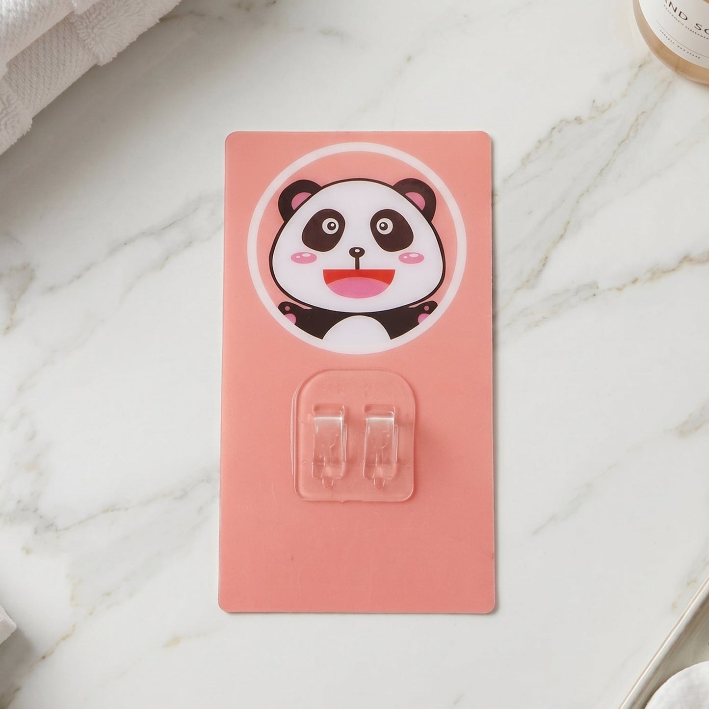 Bathroom setting with cartoon plastic wall hook for towels